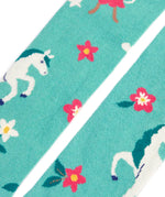 Close up of the Frugi children's Norah organic cotton knitted tights in moss green with unicorns.
