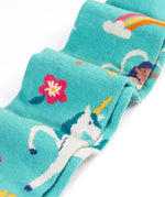 Close up of the Frugi children's Norah organic cotton knitted tights in moss green with unicorns.