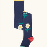 Frugi children's Norah organic cotton knitted tights in navy blue with flowers.