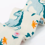 Frugi children's Norah organic cotton knitted tights in white with pegasus and flowers patterns.