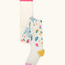 Frugi children's Norah organic cotton knitted tights in white with pegasus and flowers patterns.