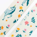 Frugi children's Norah organic cotton knitted tights in white with pegasus and flowers patterns.