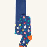 The Frugi Norah footed tights with a navy blue, flowers print design. 