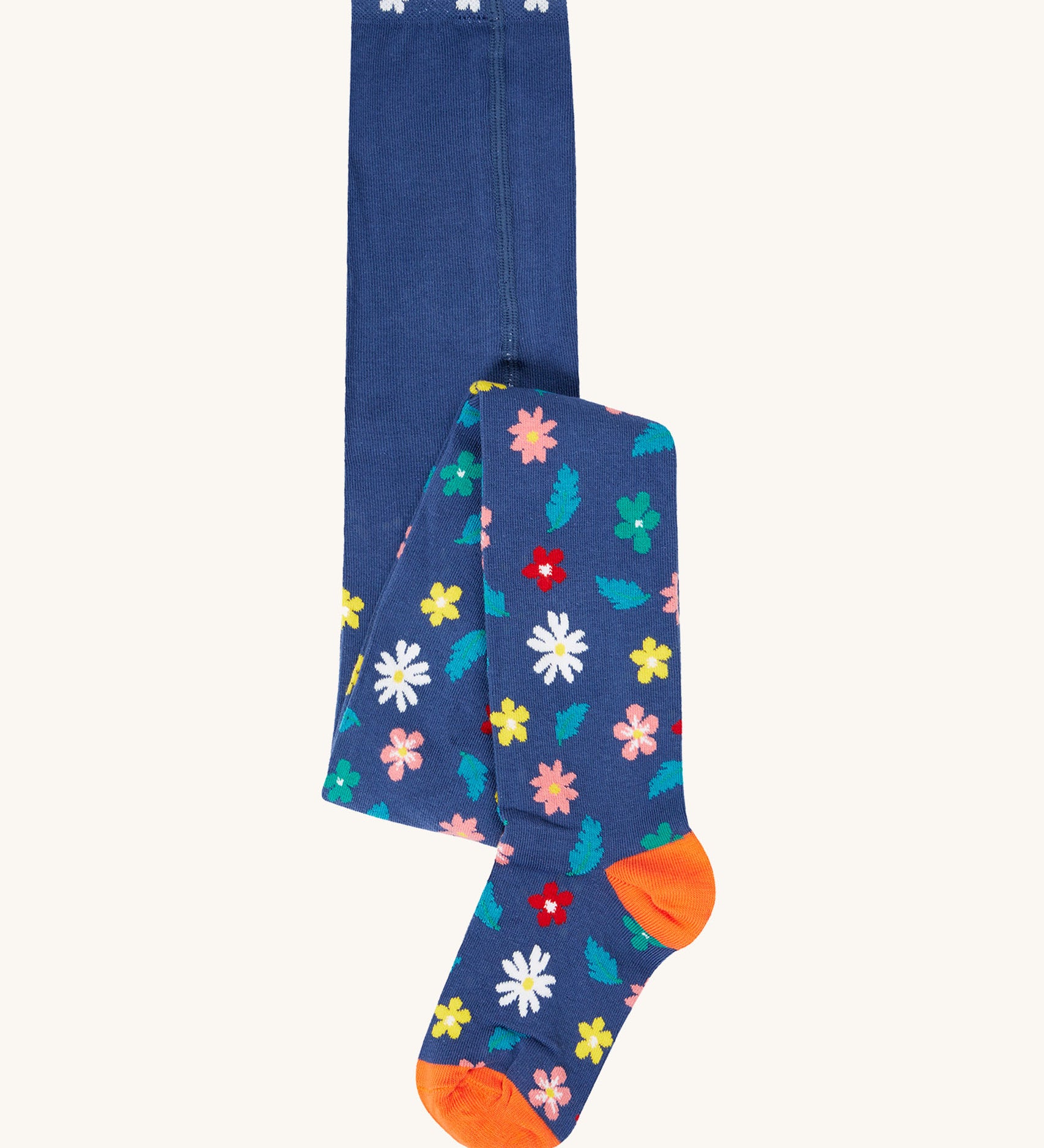 The Frugi Norah footed tights with a navy blue, flowers print design. 