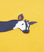 Close up of the Frugi kids bumblebee okapi short sleeve t-shirt. showing the head of the okapi animal appliqué on yellow organic cotton fabric