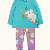 Frugi Ola outfit with boat blue koala applique long sleeve top with cuddles print purple leggings. 