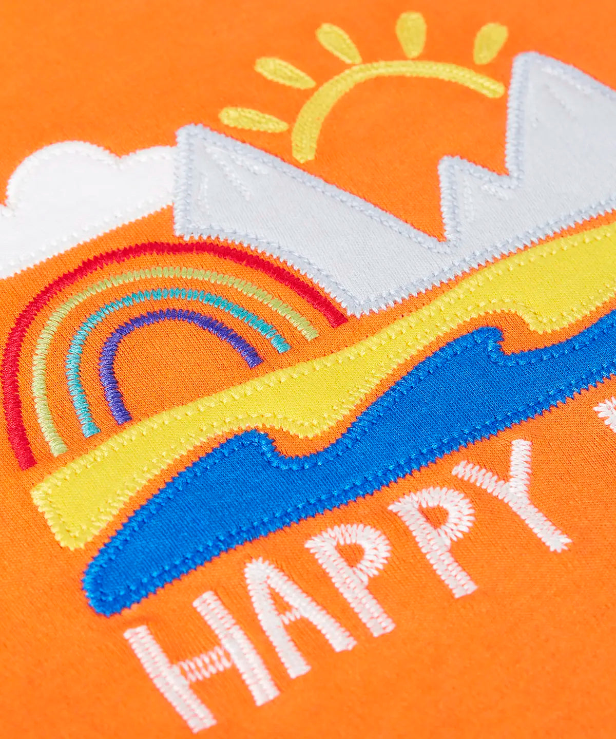 Frugi  t-shirt showing a close up of the beach applique and happy days slogan on orange fabric