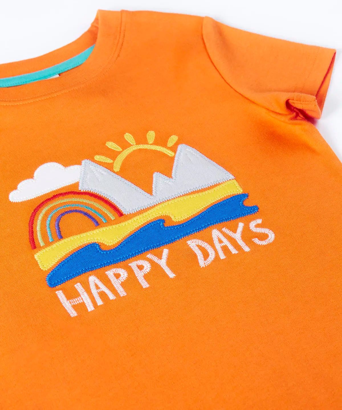 Frugi GOTS organic cotton short sleeve t-shirt in orange laid flat showing a beach applique and happy days slogan on the chest and ribbed collar