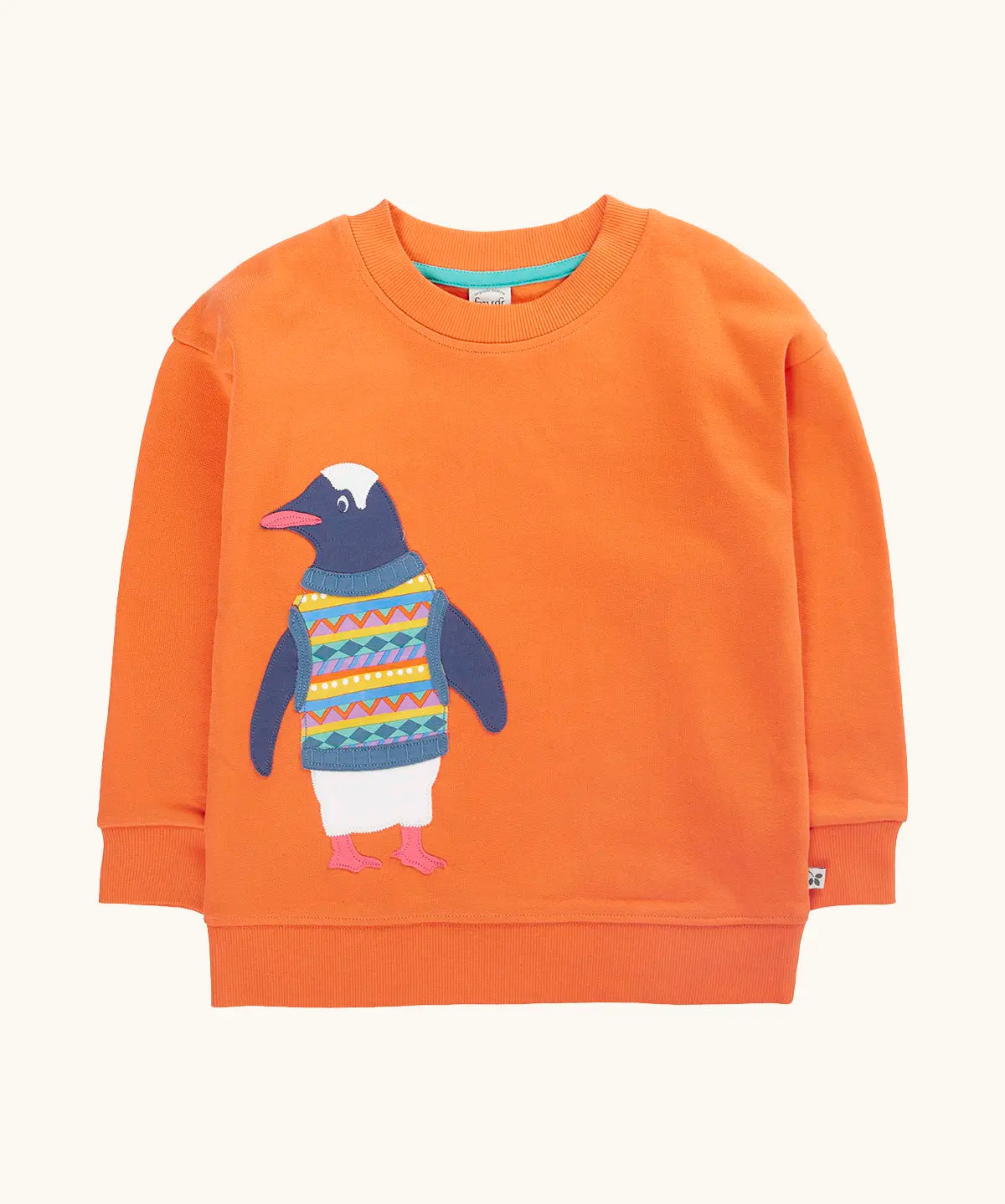 Frugi organic cotton superb sweatshirt salamander orange with penguin applique. The penguin is wearing a fairisle style tank top. 