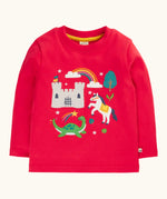 Frugi red organic cotton adventure magic applique top. Long sleeved top with castle, rainbow, tree horse and nessie appliques on the front. 