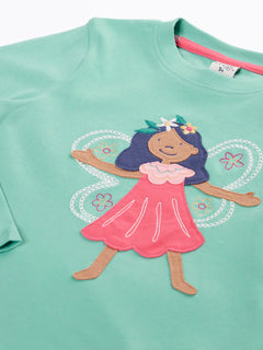 Close up of the front Frugi organic cotton adventure circular long sleeve top in moss green with fairy applique.