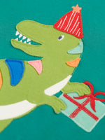 Close up of the green t-rex dinosaur applique on the Frugi organic cotton adventure long sleeve hut green child's top.