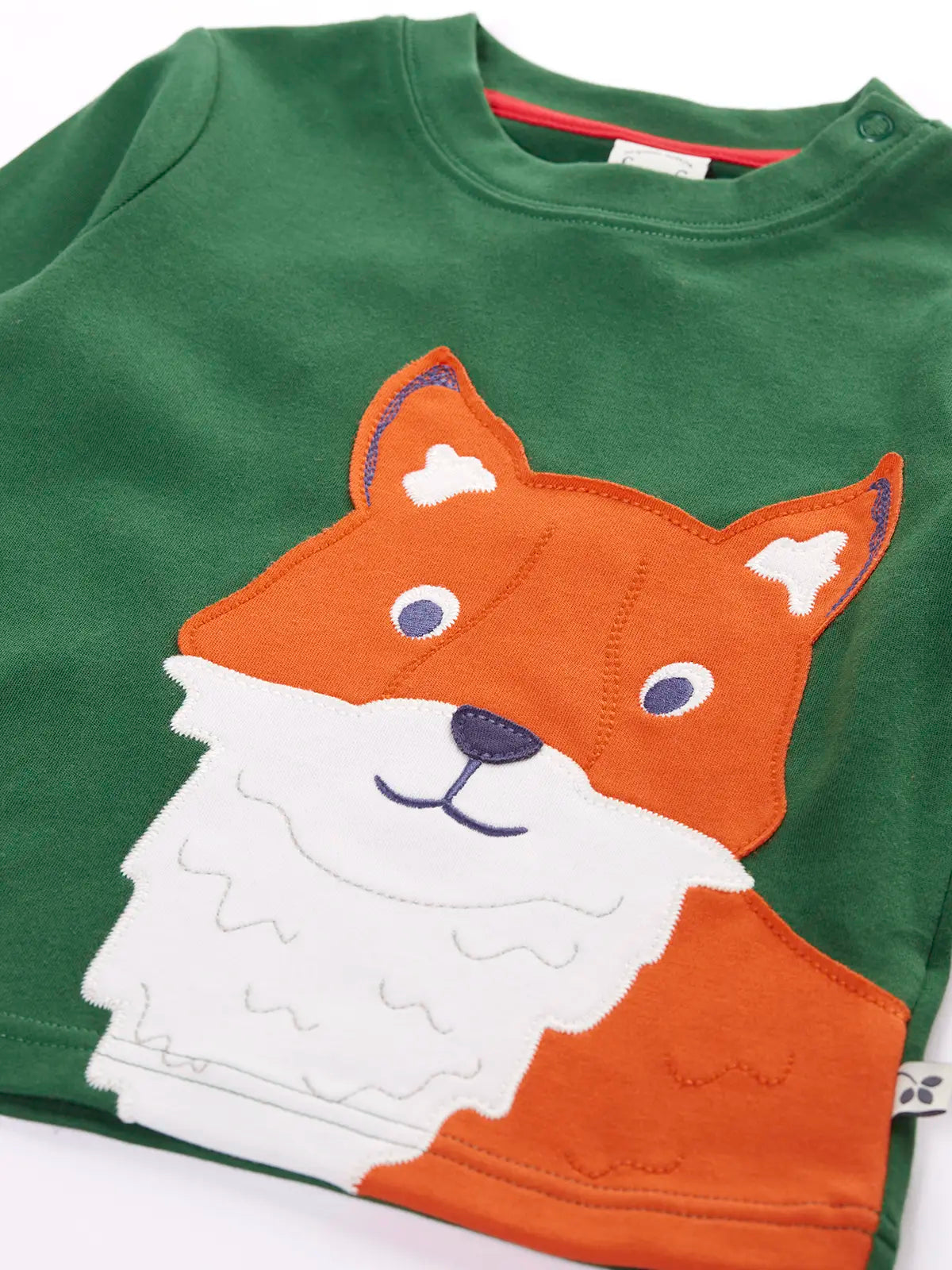 Close up of large fox applique on the Frugi organic cotton adventure long sleeve top in forest green.