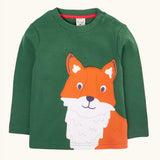 Frugi organic cotton adventure long sleeve top in forest green with large fox applique on the front with festive check trousers.