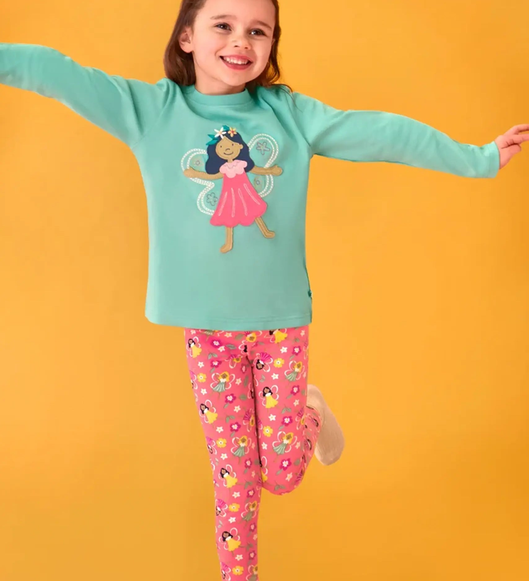 Frugi organic cotton adventure circular long sleeve top in moss green with fairy applique with pink all over fairy print leggings.