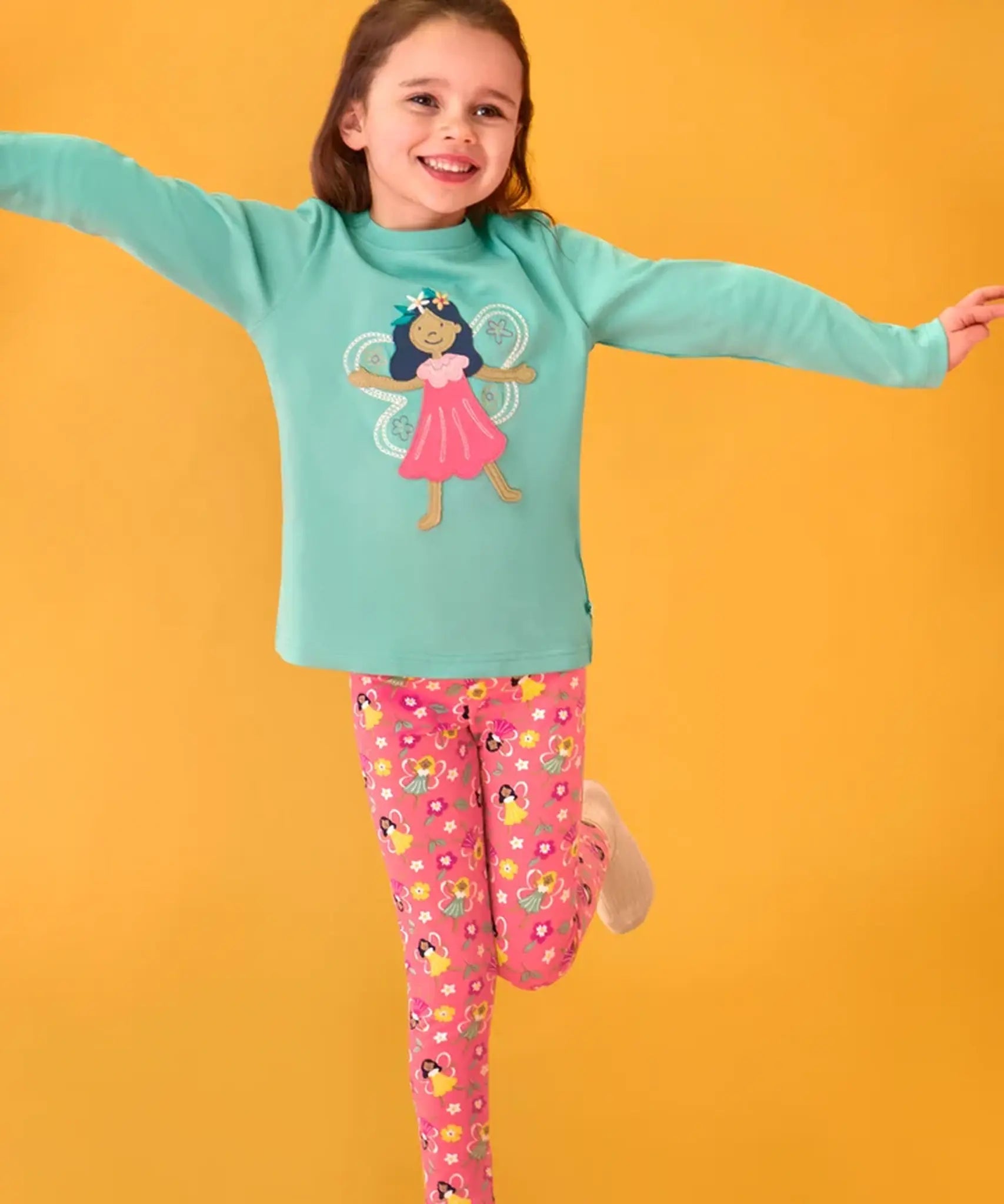 Frugi organic cotton adventure circular long sleeve top in moss green with fairy applique with pink all over fairy print leggings.