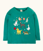Frugi organic cotton anna pet Paw-Ty appliqué long sleeve children's top. Green top with applique dogs, guinea pig, budgie, goose and tortoise wearing party hats and balloons and star sparkle details. 