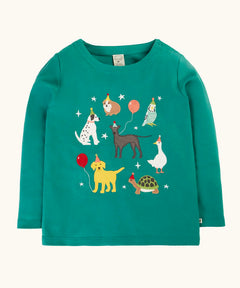 Frugi organic cotton anna pet Paw-Ty appliqué long sleeve children's top. Green top with applique dogs, guinea pig, budgie, goose and tortoise wearing party hats and balloons and star sparkle details. 