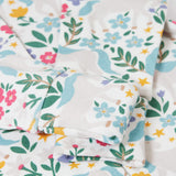 A close up of the fold over cuffs on the babygrow included in the Frugi Unicorn Forest Organic Cotton Babygrow Gift Set. This baby grow set  comes with a white babygrow decorated with an all over unicorn forest themed print and comes with a matching bandanna style bib. 
This baby gift set is a part of a wide range of organic cotton clothing for children available here at Babipur. 