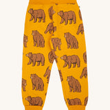 Frugi kids beary wild parsnip joggers available at Babipur. A GOTS organic cotton jogger in dark yellow with sketched style prints of a brown bear 