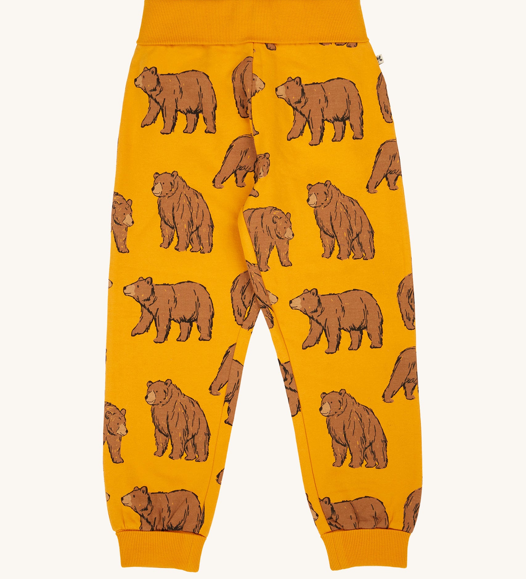 Frugi kids beary wild parsnip joggers available at Babipur. A GOTS organic cotton jogger in dark yellow with sketched style prints of a brown bear 