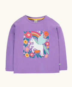 Frugi organic cotton bethany long sleeved periwinkle purple top with a pegasus applique with a rainbow and flowers. 