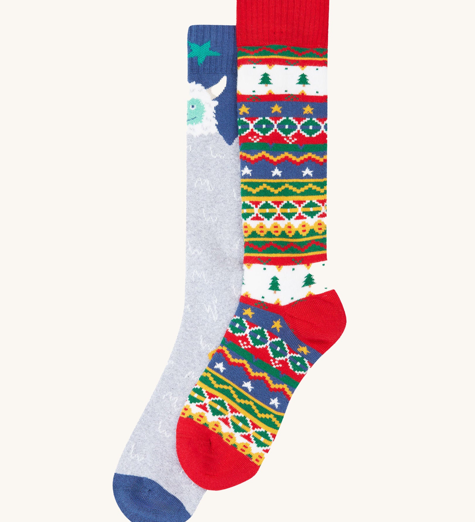 A 2 pack of Frugi Brilliant Boot organic cotton kids Socks. One pair has a yeti design, one has a fairisle design. These Christmas socks are part of a wide range of organic cotton clothing for children available here at Babipur. 