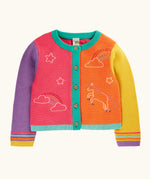 Frugi organic cotton cammie cardigan with a hotchpotch unicorn design. One purple, one yellow arm, half orange and half pink body with turquoise trim with rainbow stripes on the arms cuffs.