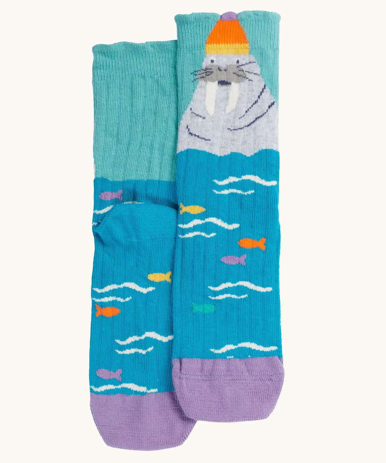 The walrus pair from the Frugi organic cotton character socks 2 pack. Blue socks with fish and a walrus wearing a bobble hat.