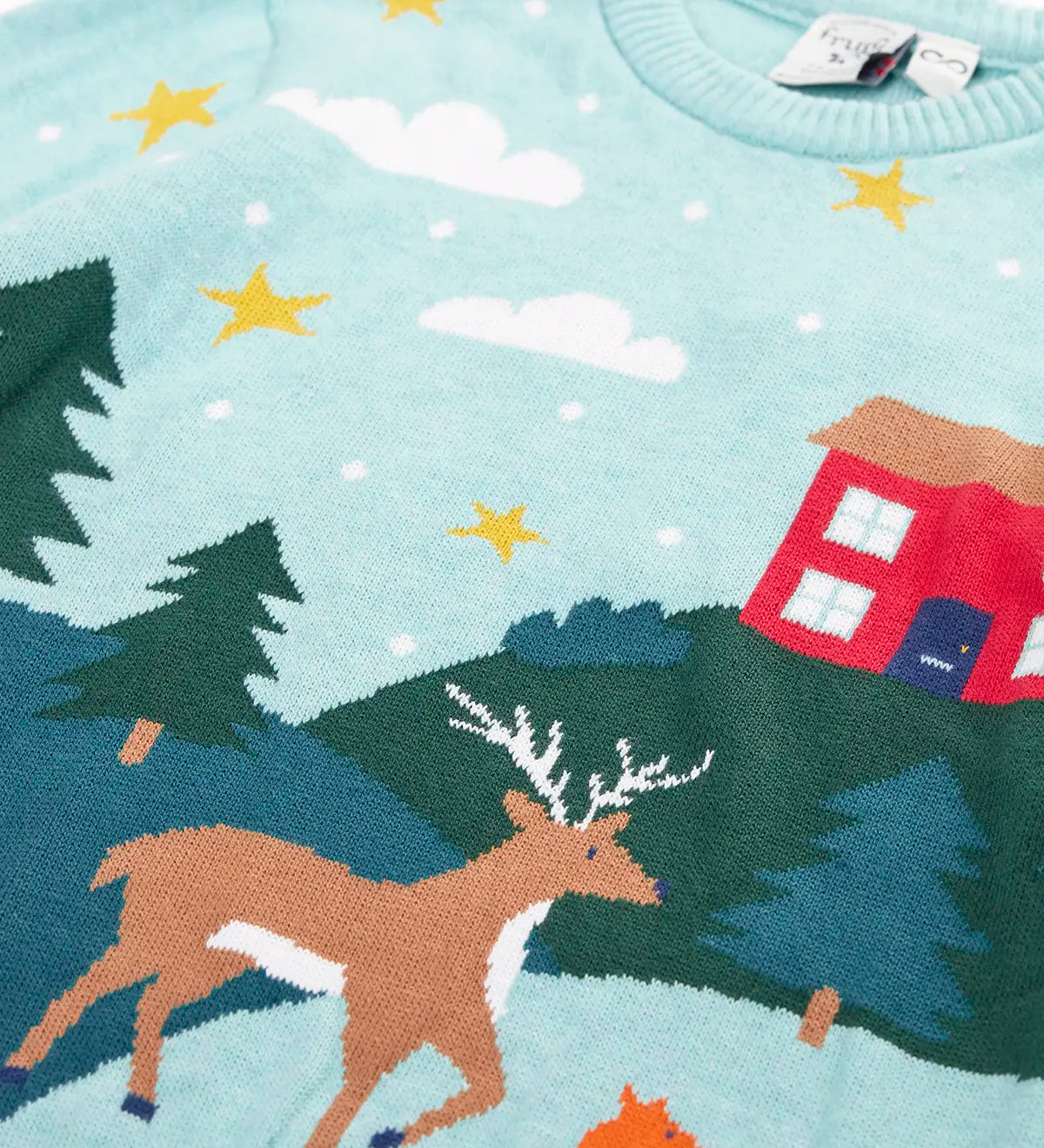Close up of the reindeer on the front of the Frugi organic cotton elwood knitted jumper with a Winter tales design.