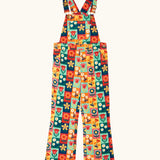 Frugi organic cotton ethel flared dungarees with rectangle flower stamps design. Multicoloured design with a variety of different flowers. 