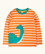 Frugi organic cotton felix long sleeve orange breton stripe top with teal nessie wrap around applique.