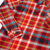 Close up of the Frugi organic cotton festive check hector shirt with chest pocket.