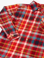 Close up of the Frugi organic cotton festive check hector shirt with chest pocket.