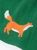 Close up of the fox applique on the hemline of the Frugi organic cotton peony holly green corduroy dress.