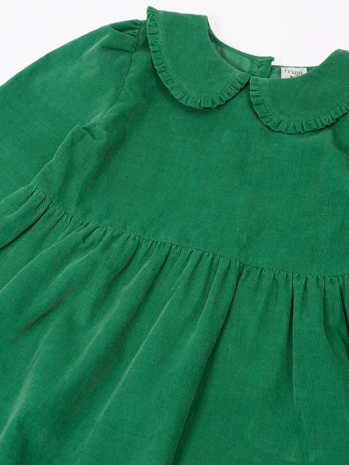 Close up of the frilled peter pan style collar on the Frugi organic cotton peony holly green corduroy dress.