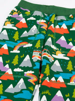 Frugi organic cotton green malpas joggers with rescue trails print. Print features colourful mountains, trees, grass, water and rescue vehicles on a bottle green background.
