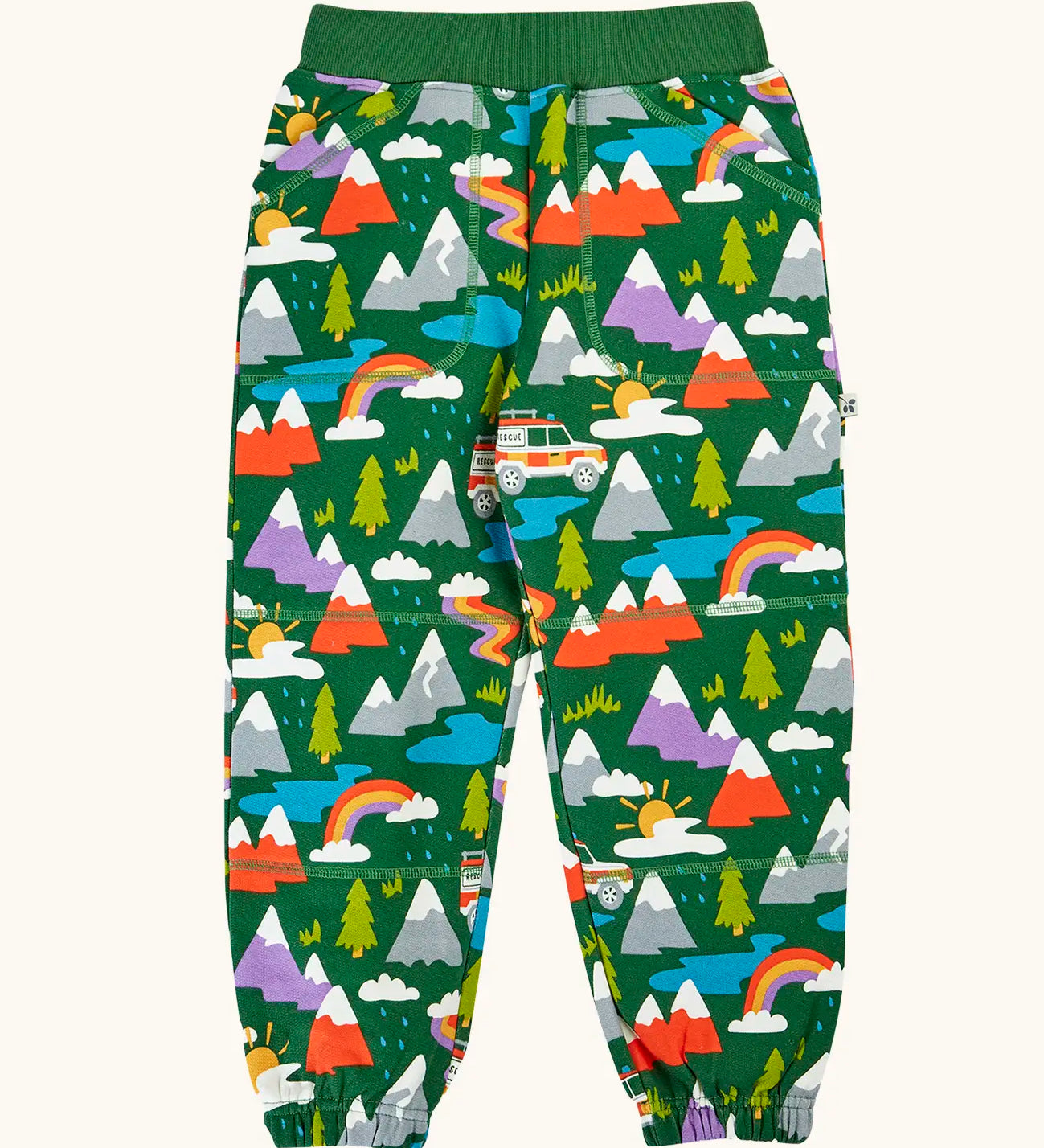 Frugi organic cotton green malpas joggers with rescue trails print. Print features colourful mountains, trees, grass, water and rescue vehicles on a bottle green background.