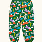 Frugi organic cotton green malpas joggers with rescue trails print. Print features colourful mountains, trees, grass, water and rescue vehicles on a bottle green background.