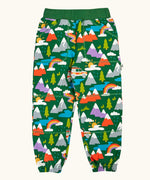 Frugi organic cotton green malpas joggers with rescue trails print. Print features colourful mountains, trees, grass, water and rescue vehicles on a bottle green background.