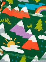 Close up of the colourful mountains featured on the Frugi organic cotton green malpas joggers with rescue trails print. 