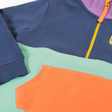 Close up of the orange kangarro pocket on the Frugi organic cotton half zip sweatshirt hotchpotch wildlife.