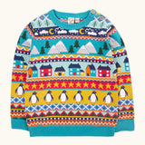 Frugi festive fair isle organic cotton children's jumper. Multicoloured fairisle design featuring penguins, stars, houses, mountain, trees, clouds and snowy clouds.