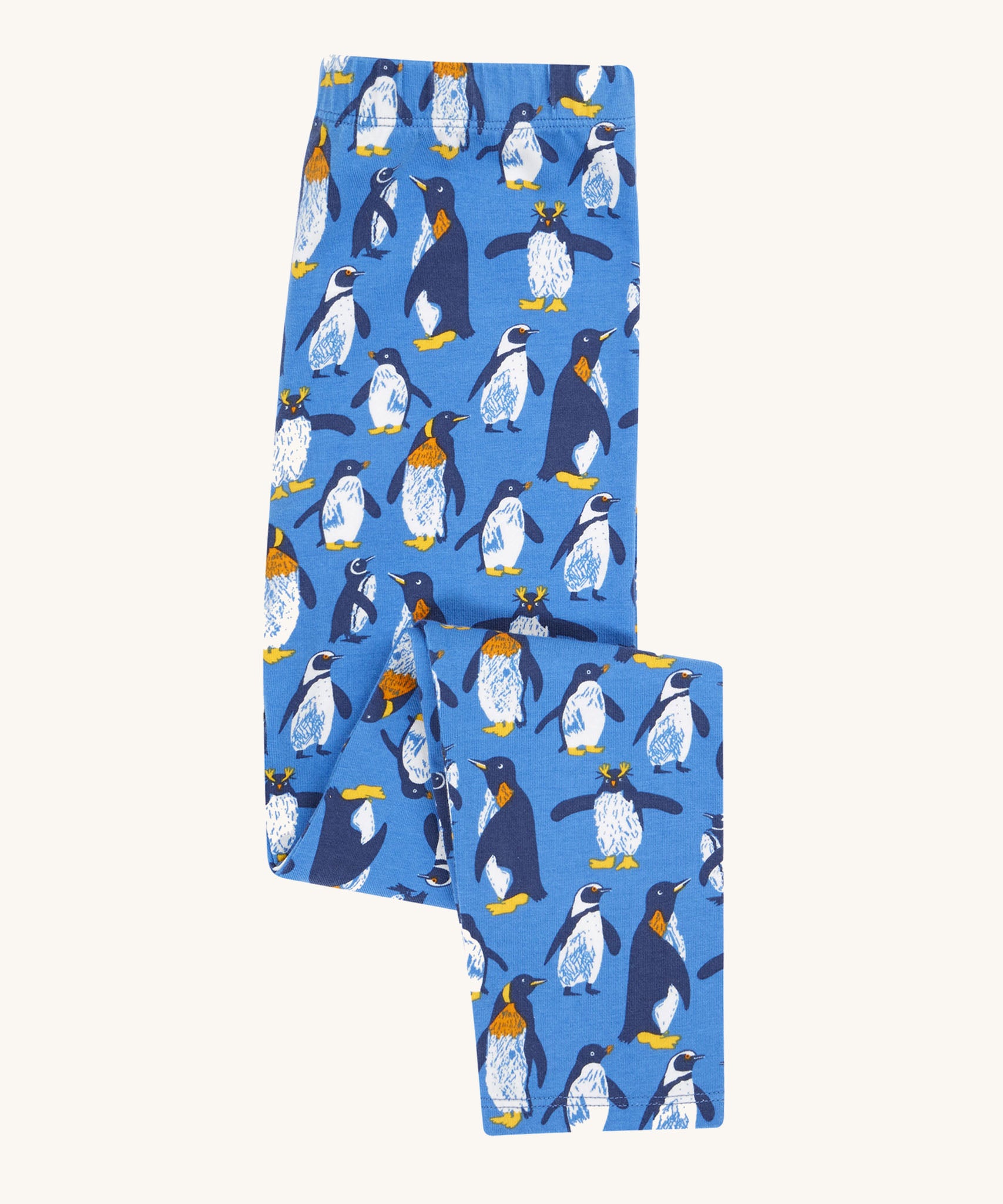 Frugi organic cotton kids libby leggings with a penguin waddle print on a blue background.