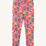 Frugi organic cotton kids Libby leggings with a fun flowers print on a pink background.