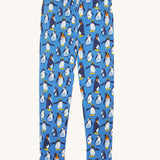Frugi organic cotton kids libby leggings with a penguin waddle print on a blue background.