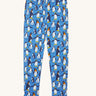 Frugi organic cotton kids libby leggings with a penguin waddle print on a blue background.