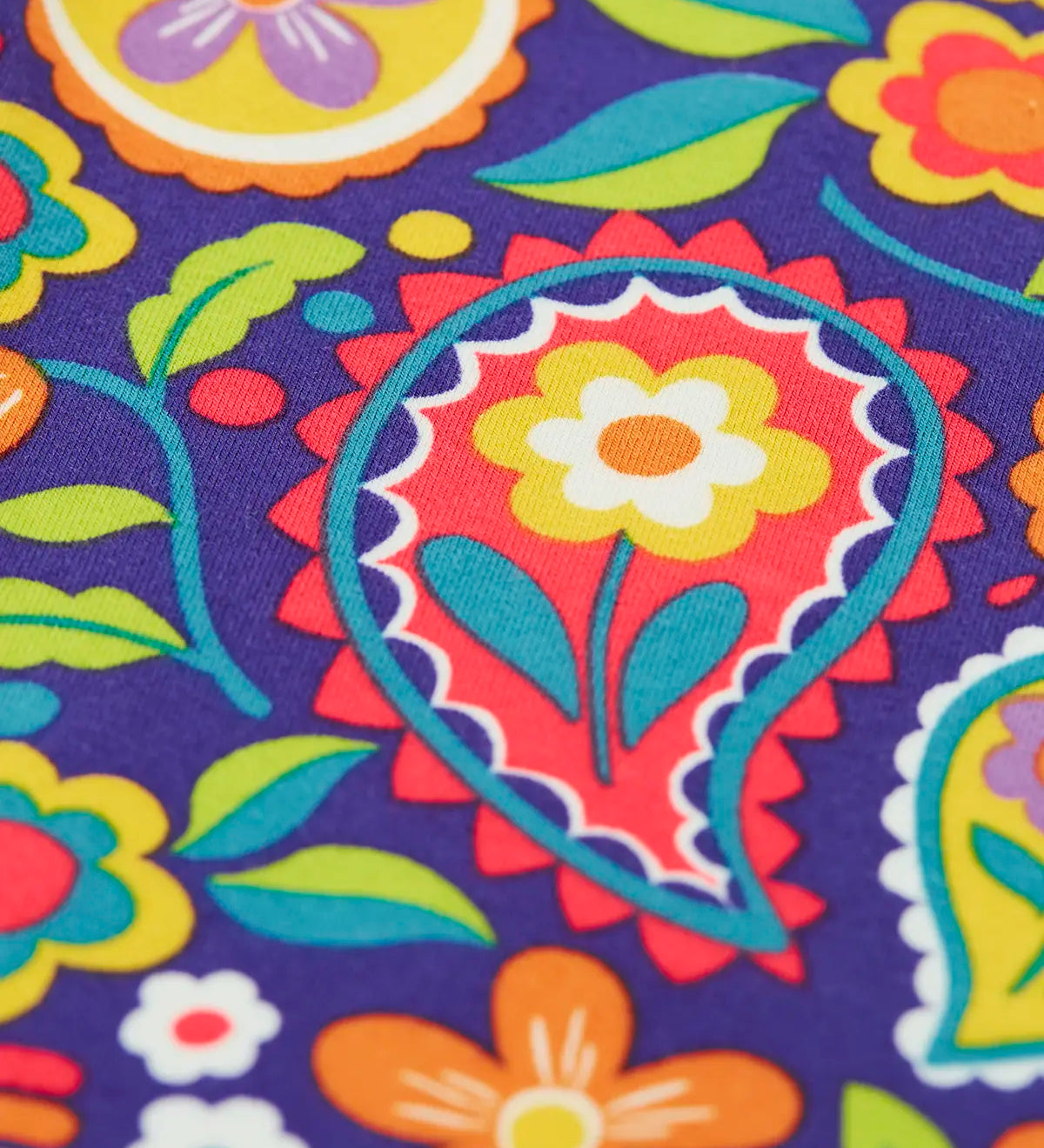 Close up of the print on the Frugi organic cotton libby leggings with a pretty paisley print. 