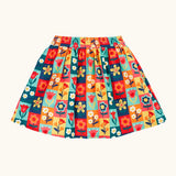 Frugi organic cotton marta twill flower stamps skirt. Multi coloured rectangles with flowers. 