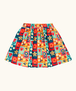 Frugi organic cotton marta twill flower stamps skirt. Multi coloured rectangles with flowers. 